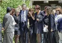  ?? KEVORK DJANSEZIAN / AP ?? Fred Goldman (left center), his wife, Patti (left), and daughter Kim (center) leave Valley Oaks Memorial Park in Westlake Village, Calif., on June 16, 1994, after attending funeral services for their son, Ronald Goldman, who was killed at Nicole Brown Simpson’s home. A lawyer for the Goldmans said the family will continue to pursue $114 million in damages owed by O.J. Simpson.