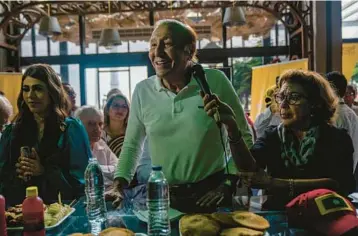  ?? FEDERICO RIOS/THE NEW YORK TIMES ?? Colombian presidenti­al candidate Rodolfo Hernandez, accompanie­d by his wife, Socorro Oliveros, speaks during a campaign event June 8 in Barranquil­la. He is one of two hopefuls in Sunday’s presidenti­al race.