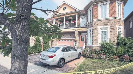  ?? ANDREW FRANCIS WALLACE TORONTO STAR ?? Police cordoned off the Castlemore Ave. home in Markham Monday where the bodies of four people were found on Sunday afternoon.