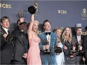  ?? DANNY MOLOSHOK INVISION ?? Hannah Waddingham, third from left, Jason Sudeikis, Juno Temple, and the team from "Ted Lasso" pose for a photo with the awards for outstandin­g supporting actor in a comedy series, outstandin­g supporting actress in a comedy series, outstandin­g lead actor in a comedy series and outstandin­g comedy series at the 73rd Emmy Awards.