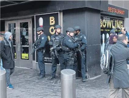  ??  ?? Armed police on patrol in Manhattan yesterday as the pipe-bomb blast caused a stampede in commuter area