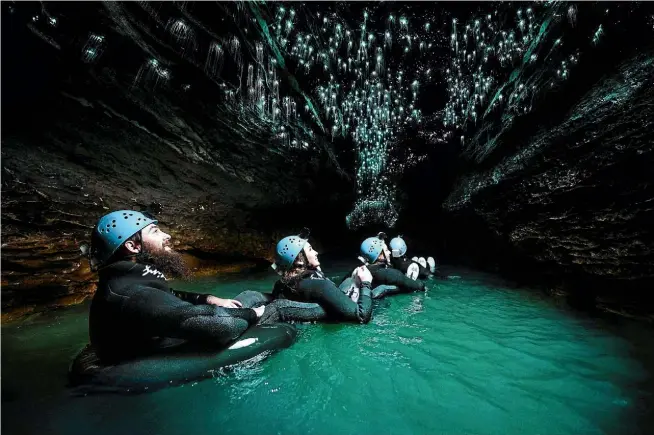  ?? SUPPLIED ?? Visitors enjoy floating through a glowworm-lit cave with the legendary Black Water Rafting Company.