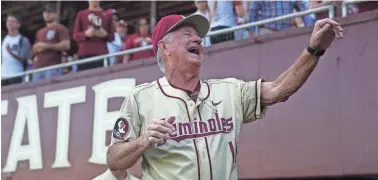  ?? JOE RONDONE/DEMOCRAT ?? FSU Head Coach Mike Martin celebrates his 1900th win with his team after they defeated VCU 11-3 at Dick Howser Stadium on Sunday, Feb. 19, 2017.