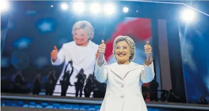 ??  ?? Democratic presidenti­al nominee Hillary Clinton gives her thumbs up as she appears on stage during the final day of the Democratic National Convention in Philadelph­ia on Thursday.