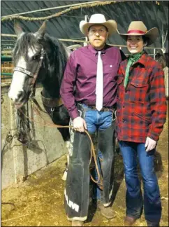  ??  ?? Kelly and Tesa Klein pose backstage at the N.D. Winter Show, where Tesa serves as general manager and Kelly works as a pickup man during the PRCA rodeo.