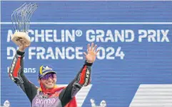  ?? AFP ?? Jorge Martin holds the trophy as he celebrates on the podium of the French MotoGP in Le Mans.