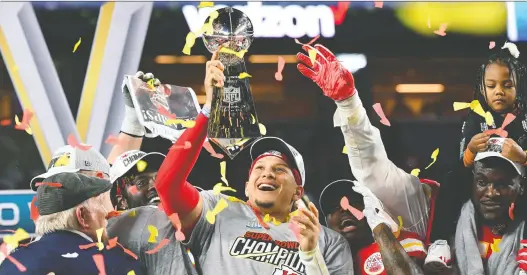  ?? ROBERT DEUTSCH/USA TODAY SPORTS ?? Kansas City Chiefs quarterbac­k Patrick Mahomes hoists the Vince Lombardi Trophy after defeating the San Francisco 49ers in Super Bowl LIV.