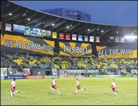  ?? STEVE DYKES / GETTY IMAGES ?? Portland Timbers fans known as “Timbers Army” come out in force with tifos for home games at Providence Park in Portland, Ore.