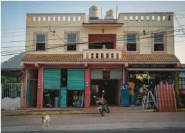  ?? ?? Claudia Perez’s house and business premises in Coacoatzin­tla were built with the remittance­s she sent during the years she worked in Chicago.