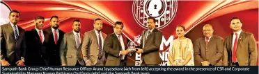  ??  ?? Sampath Bank Group Chief Human Resource Officer Aruna Jayasekara (4th from left) accepting the award in the presence of CSR and Corporate Sustainabi­lity Manager Nuwan Pathirana (3rd from right) and the Sampath Bank team