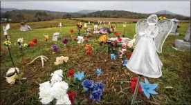  ?? TY GREENLEES / STAFF 2016 ?? The gravesite of six of the eight Rhoden family members who were killed in rural Pike County in 2016. Gov.-elect Mike DeWine announced Tuesday that four members of the Wagner family had been arrested and face murder charges.