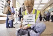  ?? Al Seib Los Angeles Times ?? SHANNON McGINNIS protests route of bullet train, which is receiving $3.2 billion in federal grants.