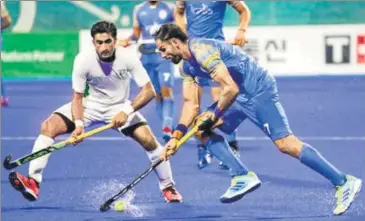  ?? AP ?? India's Manpreet Singh (R) during their bronze medal playoff against Pakistan in Jakarta on Saturday.