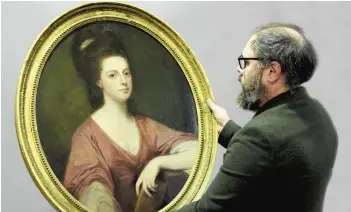  ?? ?? Fine Art consultant Tim Williams with rediscover­ed portrait of Lady Laetitia Beauchamp-Proctor by English artist George Romney