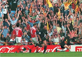  ??  ?? Ally McCoist races away to celebrate after scoring the winner for Craig Brown’s Scotland over Switzerlan­d during Euro ‘96.