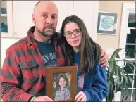  ?? Dave Collins / Associated Press ?? Mark Barden and his daughter, Natalie, with a photograph of Natalie’s late brother, Daniel, who died in the Dec. 14, 2012, Sandy Hook Elementary School shooting that killed 20 first-graders and six educators.