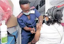  ?? | KZN DEPARTMENT OF HEALTH ?? A PATIENT receives a Covid-19 jab.