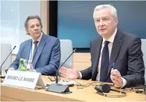  ?? AFP PHOTO ?? French Finance Minister Bruno Le Maire (right) speaks during a press briefing with Brazilian Finance Minister Fernando Haddad at the Internatio­nal Monetary Fund headquarte­rs in Washington, D.C., on Wednesday, April 17, 2024. Both ministers are pushing for fair internatio­nal taxation.