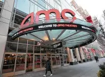  ?? Evan Agostini / Associated Press ?? AMC Theatres says it will have 98 percent of its U.S. movie theaters open on Friday, with more expected by March 26. Shares of the chain were up more than 4 percent before the market opened Thursday.