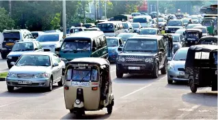  ??  ?? File picture of traffic in Colombo.