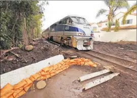  ?? Al Seib Los Angeles Times ?? AMTRAK is running about 10 trains a day with additional cars through Montecito to help people bypass the 101 Freeway, which was closed by the mudslide.