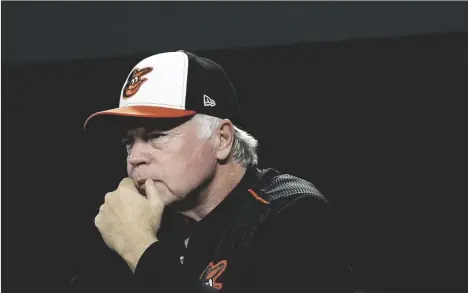  ?? AP PHOTO/PATRICK SEMANSKY ?? Baltimore Orioles manager Buck Showalter stands in the dugout in the second inning of a baseball game against the Oakland Athletics, on 2018 in Baltimore.