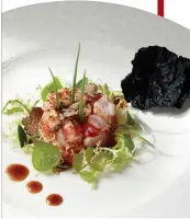  ??  ?? A salad of Carabinero prawn with black truffle and squid-ink rice cracker.