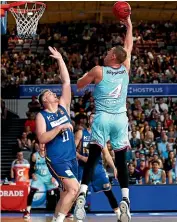  ?? PHOTOSPORT ?? Colton Iverson soars to score for the Breakers against Brisbane on Saturday.