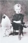  ?? SUBMITTED ?? Daryl MacTavis is a collector of antique photos. One,circa 1910, is a curly blond-haired boy in a photo studio sitting with a really big chicken beside him, and the boy is incongruou­sly smoking a cigarette.