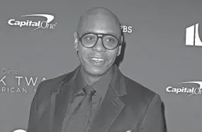 ?? OWEN SWEENEY/INVISION/AP ?? Yellow Springs resident Dave Chappelle was apparently rushed on stage by an audience member Tuesday night during a performanc­e at the Hollywood Bowl in Los Angeles.