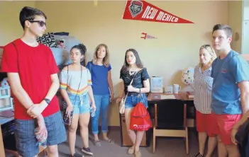  ?? MARLA BROSE/JOURNAL ?? Prospectiv­e University of New Mexico students and their family members got a look inside a campus dorm room last week as part of a campus tour. UNM needs to add about 9,000 students each year to maintain enrollment numbers. Visitors include Case...