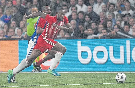  ??  ?? Usain Bolt, right, during a friendly football match in Paris in June.