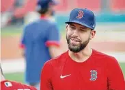  ?? Michael Dwyer/Associated Press ?? Boston Red Sox's Matt Barnes talks with a teammate during a 2020 practice at Fenway Park in Boston.