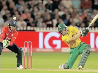  ?? ?? SOUTH Africa’s Tristan Stubbs hits a six as England’s wicketkeep­er Jos Buttler looks on during the first T20 internatio­nal cricket match at Bristol County Ground, in Bristol, England. | GEOFF CADDICK AFP