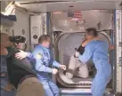  ?? Handout / NASA TV/AFP via Getty Images ?? This NASA video frame grab image shows SpaceXs Crew Dragon NASA astronauts Douglas Hurley, right, and Robert Behnken, left, arriving after the hatch opened to the Internatio­nal Space Station on Sunday with other astronauts.