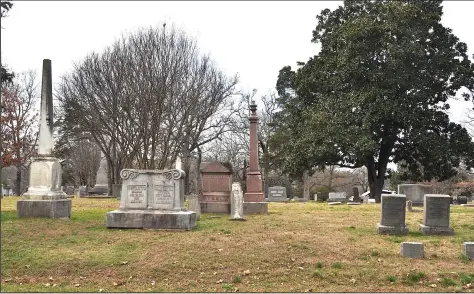  ?? (Special to the Democrat-Gazette/Sonny Rhodes) ?? The obelisk (left) that designates Dr. C.V. Meador’s gravesite stands just south of the grave of Calvin C. Bliss (second marker from right). The two had a bitter word battle in 1864-65.