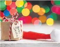  ?? FILE ?? Some millennial­s want Secret Santas and other office-related celebratio­ns that involve co-workers “chipping in” for gifts to be banned, according to a new survey.