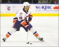  ?? Christian Abraham / Hearst Connecticu­t Media ?? The Sound Tigers’ Josh Ho-Sang passes the puck against Hartford on Nov. 23 in Bridgeport.