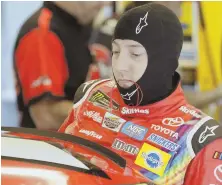  ?? AP PHOTO ?? WIRED UP: Kyle Busch climbs into his car for yesterday’s practice session at Indianapol­is Motor Speedway.