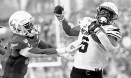  ?? MIKE EHRMANN/GETTY ?? Patrick Taylor Jr. (6) of Memphis picks up yardage against USF during the Tigers’ rout of the Bulls on Saturday at Raymond James Stadium in Tampa.