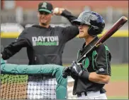  ?? MARC PENDLETON / STAFF ?? Dragons outfielder T.J. Friedl awaits his turn to bat against pitching coach Derrin Ebert in Wednesday’s batting practice at Fifth Third Field.