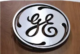  ??  ?? CRANBERRY TOWNSHIP, PENNSYLVAN­IA: In this Thursday, Jan. 16, 2014, file photo, a General Electric logo is displayed at a store. —AP