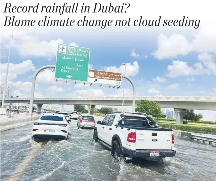  ?? REUTERS ?? CARS DRIVE through a flooded road after a rainstorm in Dubai, United Arab Emirates, April 17.