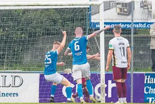  ?? ?? Stranraer’s Ryan Edgar (No. 25) guides the ball into the net to put his team 2-0 up against Stenhousem­uir.