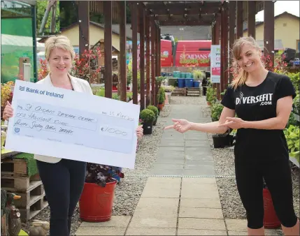  ??  ?? Eimear Mannion, CEO of St Aidan’s Services, receives a cheque for €1,000 from Shelley Atkins at St Aidan’s garden centre. The proceeds were raised from her online fitness classes at ‘Diversefit.com’.