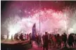  ?? — AFP ?? People watch fireworks during the inaugurati­on of Tibar Bay port in Liquica on Thursday.