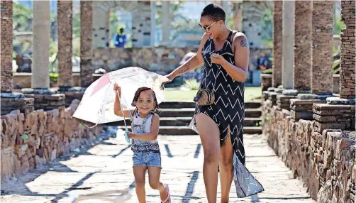  ?? | ZANELE ZULU African News Agency (ANA) ?? A MOTHER and child enjoy a walk near the beachfront in Durban. Women are generally not compensate­d for the care work that they do, despite being vital to the functionin­g of the paid economy and a well-functionin­g society, says the writer.