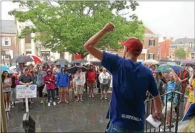  ?? PETE BANNAN – DIGITAL FIRST MEDIA ?? Leo Olsen rallies the crowd Sunday evening on the steps of the historical Chester County Courthouse as they protest the Trump administra­tion’s immigratio­n policies and in support of local immigrant communitie­s.