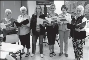  ?? Submitted photo ?? PLEASING PITCH: Developing a perfect harmony, the ladies of Voices Rising, from left, Joyce Baroni, Carmen Edwards, Alice Canham, Jill Fitzgerald, Kay Crews, and Director Fran Stroud, practice for their rendition of “Hallelujah,” part of a concert...