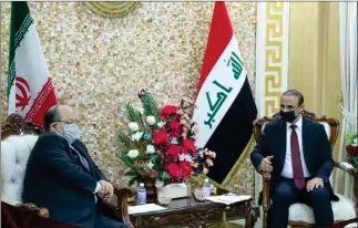  ?? Mcls.gov.ir ?? Iran’s Minister of Cooperativ­es, Labor and Social Welfare Mohammad Shariatmad­ari (L) meets with Iraq’s Labor and Social Affairs Minister Adel al-rikabi in Baghdad on April 11, 2021.